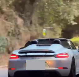 敞篷保時捷掛點滴上路畫面瘋傳　專家提醒用路安全不容忽視